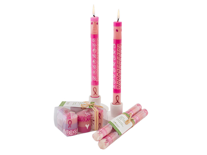 Pink on Pink candles are shipped in a matched pair with story card or 2" votive candles tht are shipped in a gift 6-pack.  The darker background shows off the tapers burning.