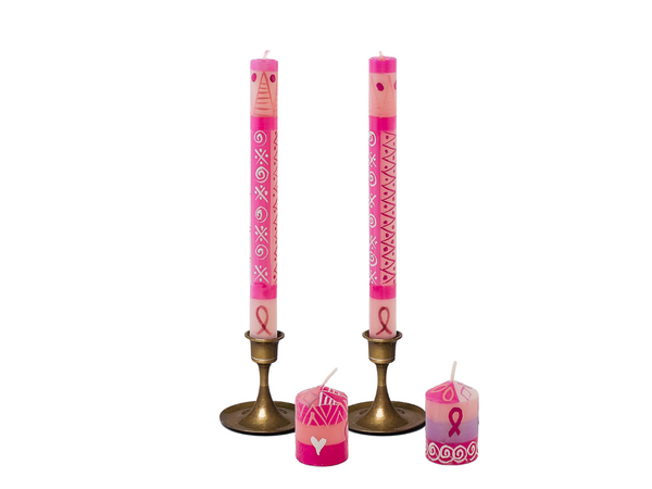 Pink on Pink hand made and hand painted taper candles and votive candles.  Light pink background with dark pint and white desiign.  Sma;; breast cancer symbol in incorporated in to the degisn.  A donation for he purchase of these candels go in suppor of Pink Drive.