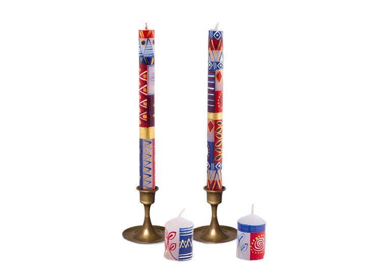 Red, White & Blue hand crafted taper candles with brass candle holders, and two votive candles. Red, white, blue, and gold pigment paintings.