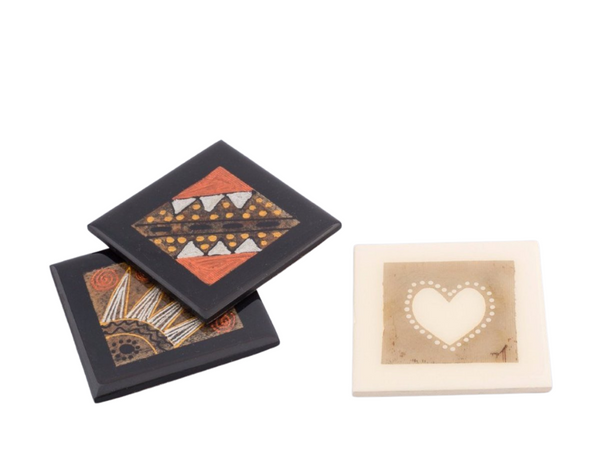 Wooden coasters hand crafted using recycled tea bags as the pallet for the painted inside design. Fair trade home decor.