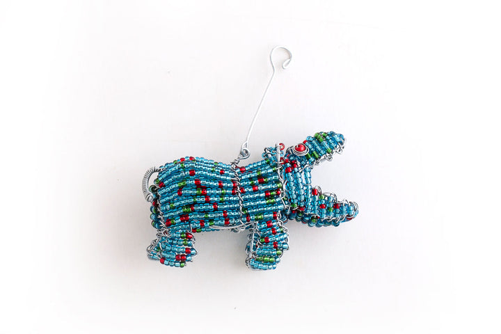 Happy Hippo hand beaded Christmas ornament in blue with flicks of red & greeen