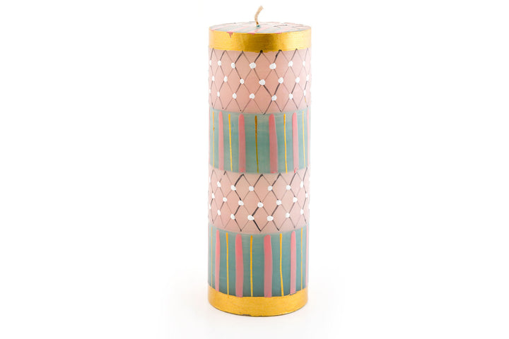 This 3" X 8" Pastel Gold pillar candle burns 100 hours and is a stunning addition to any dinner table!  Handmade and hand painted. Fair Trade.