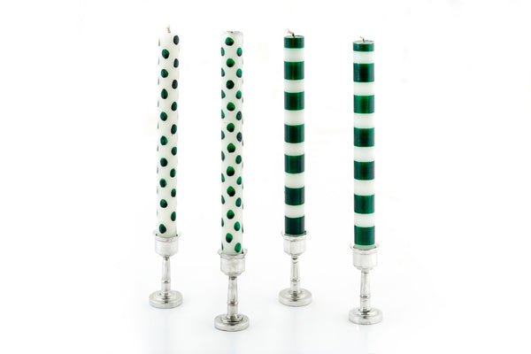 Two green dots on white candle tapers and two green stripe on white candle tapers in pewter candle holders.  Hand crafted and Fair Trade.