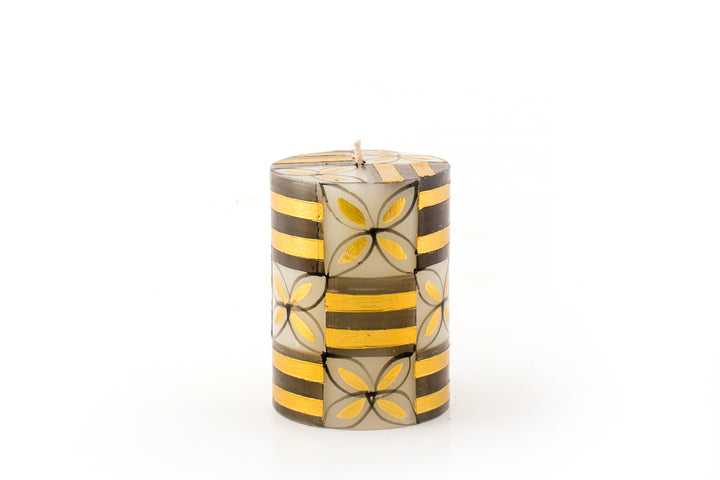 Celebration Black & Gold pillar candle.  3" X 4" and burns 60 hours.  Handmade and hand painted in South Africa.  Fair Trade home decor.