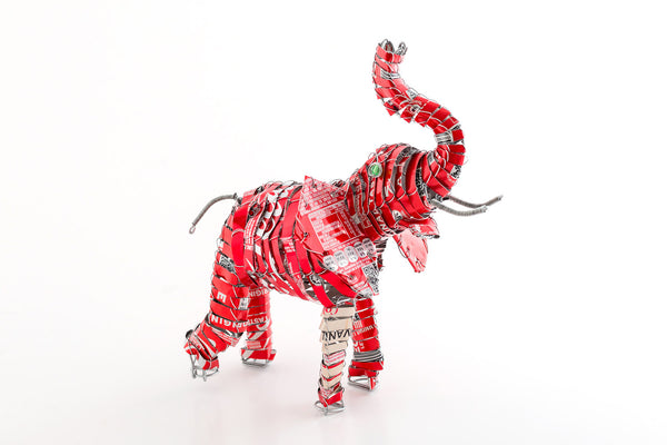 Recycled Coke tins are used to hand make these happy elephants with trunk up for Good Luck! Fair Trade.
