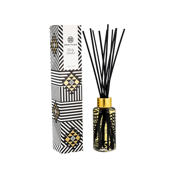 The Unity Basket 100ml room diffuser and gift box. The box is pattern represents the basket given to at Zulu weddings to represent the tight weave of a marriage and family.  The glass jar of the diffuser has the same pattern in black, with natural reeds painted black. Stunning!