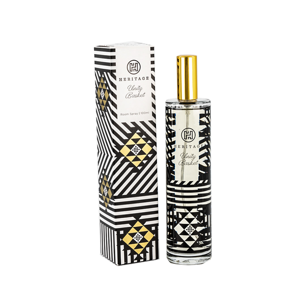 The Unity Basket 100ml room spray and gift box. The box has the black & gold pattern of the Zulu basket given at weddings to represent woven strength of the relationship of a marriage and family. The glass bottle has the same black pattern. 