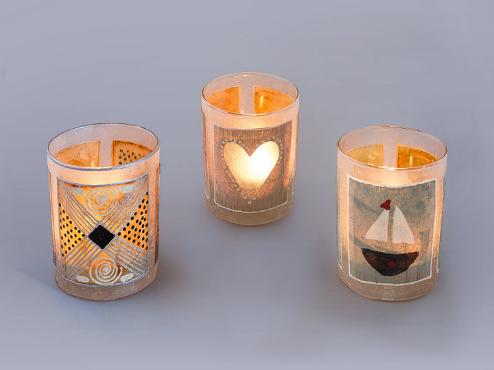 Tea light candles hand crafted using painted recycled teabags to make the designs